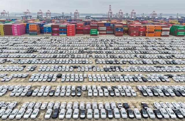 (251013) -- BEIJING, Oct. 13, 2025 (Xinhua) -- An aerial drone photo taken on Oct. 13, 2025 shows vehicles ready to be exported at Longtan Container Terminal of Nanjing Port, east China's Jiangsu Province. China's total goods imports and exports in yuan-denominated terms rose to 33.61 trillion yuan (about 4.73 trillion U.S. dollars) in the first nine months of 2025, up 4 percent year on year, official data showed Monday. (Photo by Fang Dongxu/Xinhua)