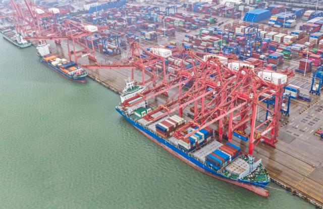 (251013) -- BEIJING, Oct. 13, 2025 (Xinhua) -- An aerial drone photo taken on Oct. 13, 2025 shows a scene at the container terminal of Lianyungang Port in east China's Jiangsu Province. China's total goods imports and exports in yuan-denominated terms rose to 33.61 trillion yuan (about 4.73 trillion U.S. dollars) in the first nine months of 2025, up 4 percent year on year, official data showed Monday. (Photo by Wang Jianmin/Xinhua)