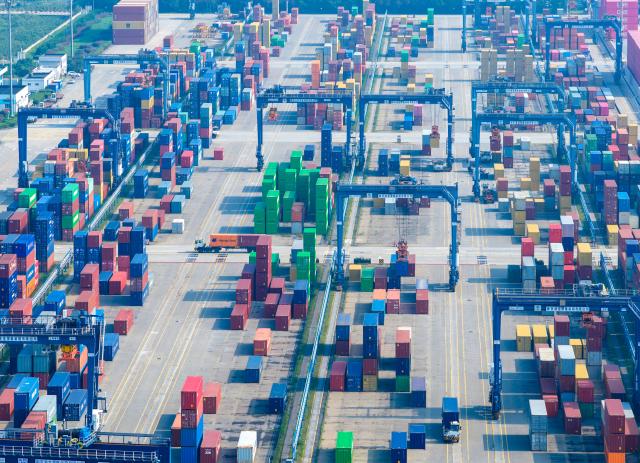 (251013) -- BEIJING, Oct. 13, 2025 (Xinhua) -- An aerial drone photo taken on Oct. 4, 2025 shows a scene at Longtan Container Terminal of Nanjing Port, east China's Jiangsu Province. China's total goods imports and exports in yuan-denominated terms rose to 33.61 trillion yuan (about 4.73 trillion U.S. dollars) in the first nine months of 2025, up 4 percent year on year, official data showed Monday. (Photo by Yang Suping/Xinhua)