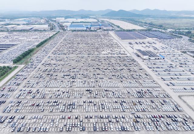 (251013) -- BEIJING, Oct. 13, 2025 (Xinhua) -- An aerial drone photo taken on Oct. 13, 2025 shows cars waiting for shipment at a port in Wuhan, central China's Hubei Province. China's total goods imports and exports in yuan-denominated terms rose to 33.61 trillion yuan (about 4.73 trillion U.S. dollars) in the first nine months of 2025, up 4 percent year on year, official data showed Monday. (Photo by Zhao Jun/Xinhua)