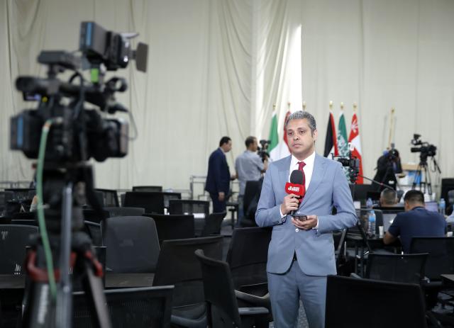 (251013) -- SHARM EL-SHEIKH, Oct. 13, 2025 (Xinhua) -- Journalists work at the media center of the venue for a summit to consolidate the Israel-Hamas ceasefire in Sharm el-Sheikh, Egypt, on Oct. 13, 2025. Egyptian Red Sea resort city Sharm el-Sheikh is gearing up to host an international summit on Monday to consolidate the Israel-Hamas ceasefire and advance a broader Middle East process. (Xinhua/Wang Dongzhen)
