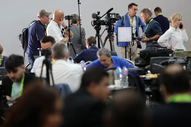 (251013) -- SHARM EL-SHEIKH, Oct. 13, 2025 (Xinhua) -- Journalists work at the media center of the venue for a summit to consolidate the Israel-Hamas ceasefire in Sharm el-Sheikh, Egypt, on Oct. 13, 2025. Egyptian Red Sea resort city Sharm el-Sheikh is gearing up to host an international summit on Monday to consolidate the Israel-Hamas ceasefire and advance a broader Middle East process. (Xinhua/Sui Xiankai)