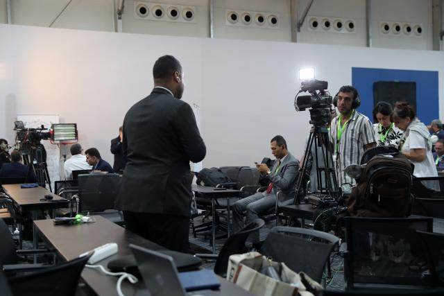 (251013) -- SHARM EL-SHEIKH, Oct. 13, 2025 (Xinhua) -- Journalists work at the media center of the venue for a summit to consolidate the Israel-Hamas ceasefire in Sharm el-Sheikh, Egypt, on Oct. 13, 2025. Egyptian Red Sea resort city Sharm el-Sheikh is gearing up to host an international summit on Monday to consolidate the Israel-Hamas ceasefire and advance a broader Middle East process. (Xinhua/Sui Xiankai)
