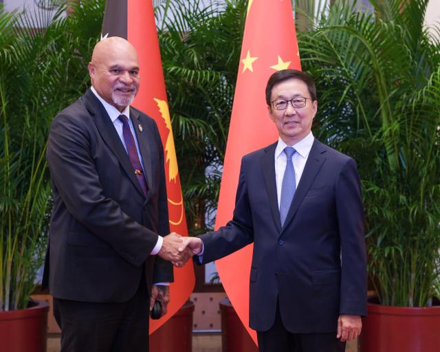 (251013) -- BEIJING, Oct. 13, 2025 (Xinhua) -- Chinese Vice President Han Zheng meets with Papua New Guinean Deputy Prime Minister John Rosso, who is here for the Global Leaders' Meeting on Women, in Beijing, capital of China, Oct. 13, 2025. (Xinhua/Ding Lin)