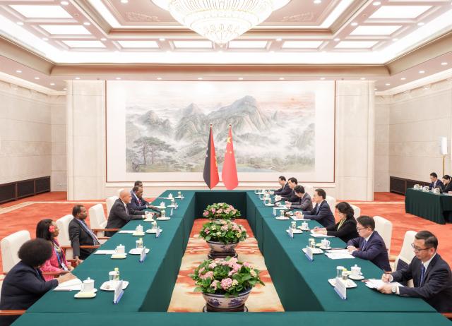 (251013) -- BEIJING, Oct. 13, 2025 (Xinhua) -- Chinese Vice President Han Zheng meets with Papua New Guinean Deputy Prime Minister John Rosso, who is here for the Global Leaders' Meeting on Women, in Beijing, capital of China, Oct. 13, 2025. (Xinhua/Ding Lin)