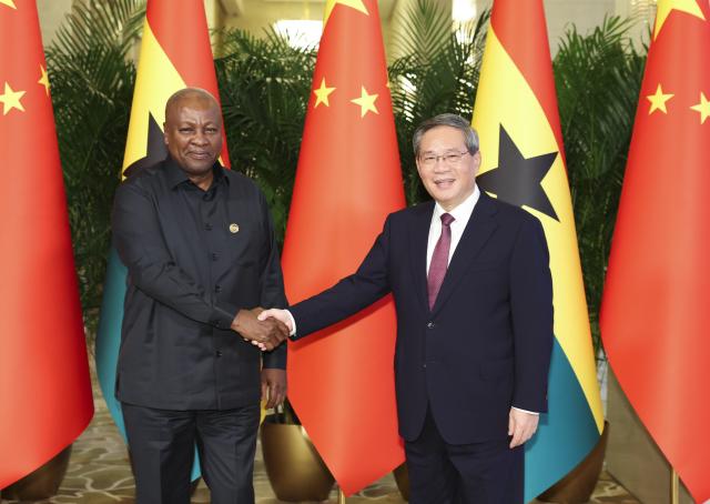 (251013) -- BEIJING, Oct. 13, 2025 (Xinhua) -- Chinese Premier Li Qiang meets with Ghanaian President John Dramani Mahama, who is here for the Global Leaders' Meeting on Women, at the Diaoyutai State Guesthouse in Beijing, capital of China, Oct. 13, 2025. (Xinhua/Huang Jingwen)