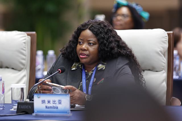 (251013) -- BEIJING, Oct. 13, 2025 (Xinhua) -- A representative from Namibia attends the plenary meeting of the Global Leaders' Meeting on Women in Beijing, capital of China, Oct. 13, 2025. (Xinhua/Zhang Yuwei)