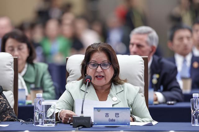 (251013) -- BEIJING, Oct. 13, 2025 (Xinhua) -- A representative from Cuba attends the plenary meeting of the Global Leaders' Meeting on Women in Beijing, capital of China, Oct. 13, 2025. (Xinhua/Zhang Yuwei)
