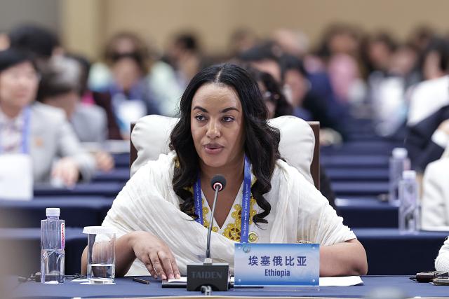 (251013) -- BEIJING, Oct. 13, 2025 (Xinhua) -- A representative from Ethiopia attends the plenary meeting of the Global Leaders' Meeting on Women in Beijing, capital of China, Oct. 13, 2025. (Xinhua/Zhang Yuwei)
