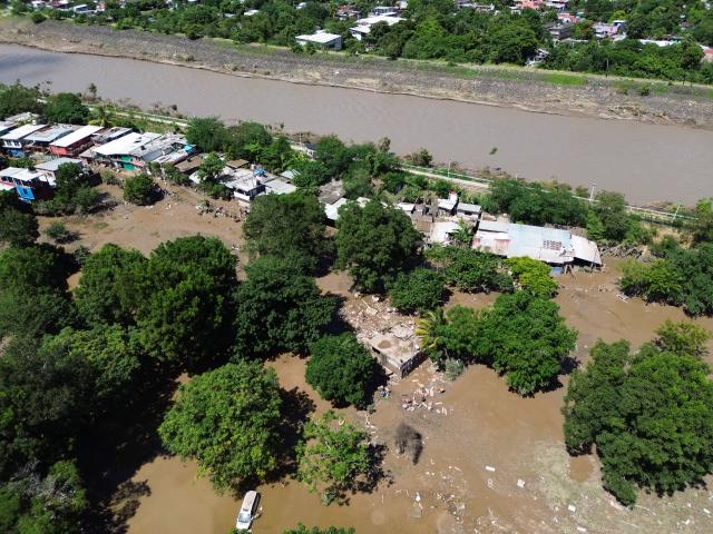(251013) -- POZA RICA(MEXICO), Oct. 13, 2025 (Xinhua) -- This drone photo taken on Oct. 12, 2025 shows the heavy rain aftermath in the city of Poza Rica, Veracruz state, Mexico. At least 64 people have died and dozens remain missing after days of torrential rains and flooding that hit central and eastern Mexico last week, authorities said Monday. (Photo by Francisco Canedo/Xinhua)