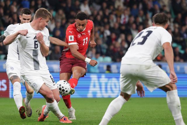 (251014) -- LJUBLJANA, Oct. 14, 2025 (Xinhua) -- Dan Ndoye (2nd R) of Switzerland competes during the World Cup 2026 European Qualifiers Group B football match between Slovenia and Switzerland in Ljubljana, Slovenia, Oct. 13, 2025. (Photo by Zeljko Stevanic/Xinhua)