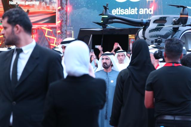 (251014) -- DUBAI, Oct. 14, 2025 (Xinhua) -- UAE Vice President and Prime Minister Sheikh Mohammed bin Rashid Al Maktoum (C) attends the 45th edition of GITEX Global in Dubai, the United Arab Emirates, Oct. 13, 2025. The 45th edition of GITEX Global, one of the world's most influential technology and artificial intelligence exhibitions, kicked off here on Monday, drawing over 6,800 tech companies and 2,000 startups from around 180 countries.
  Participants across fields such as artificial intelligence, the Internet of Things, big data, and digital governance are showcasing their latest innovations at the event.
  Some 300 Chinese tech companies, including China Mobile, China Electronics Corporation, ZTE, H3C, iFlytek, and Xpeng AEROHT, have drawn significant attention during the event with their innovative advancements in AI robotics, intelligent solutions, and flying cars, highlighting China's rapid ascent in the global technology landscape. (Xinhua/Wen Xinnian)