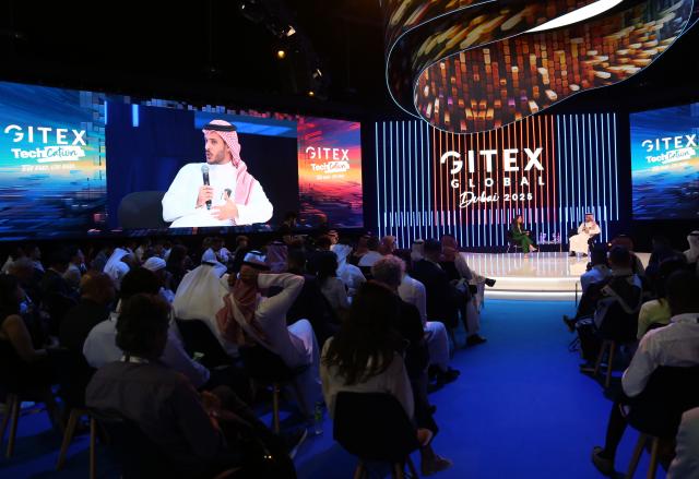 (251014) -- DUBAI, Oct. 14, 2025 (Xinhua) -- This photo taken on Oct. 13, 2025 shows a scene at a forum held during the 45th edition of GITEX Global in Dubai, the United Arab Emirates. The 45th edition of GITEX Global, one of the world's most influential technology and artificial intelligence exhibitions, kicked off here on Monday, drawing over 6,800 tech companies and 2,000 startups from around 180 countries.
  Participants across fields such as artificial intelligence, the Internet of Things, big data, and digital governance are showcasing their latest innovations at the event.
  Some 300 Chinese tech companies, including China Mobile, China Electronics Corporation, ZTE, H3C, iFlytek, and Xpeng AEROHT, have drawn significant attention during the event with their innovative advancements in AI robotics, intelligent solutions, and flying cars, highlighting China's rapid ascent in the global technology landscape. (Xinhua/Wen Xinnian)