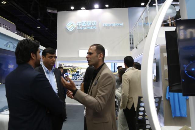 (251014) -- DUBAI, Oct. 14, 2025 (Xinhua) -- This photo taken on Oct. 13, 2025 shows a scene at the booth of Chinese telecommunications carrier China Mobile at the 45th edition of GITEX Global in Dubai, the United Arab Emirates. The 45th edition of GITEX Global, one of the world's most influential technology and artificial intelligence exhibitions, kicked off here on Monday, drawing over 6,800 tech companies and 2,000 startups from around 180 countries.
  Participants across fields such as artificial intelligence, the Internet of Things, big data, and digital governance are showcasing their latest innovations at the event.
  Some 300 Chinese tech companies, including China Mobile, China Electronics Corporation, ZTE, H3C, iFlytek, and Xpeng AEROHT, have drawn significant attention during the event with their innovative advancements in AI robotics, intelligent solutions, and flying cars, highlighting China's rapid ascent in the global technology landscape. (Xinhua/Wen Xinnian)
