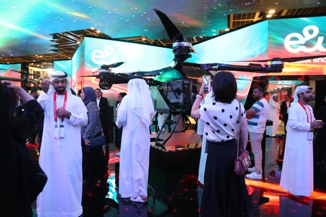 (251014) -- DUBAI, Oct. 14, 2025 (Xinhua) -- This photo taken on Oct. 13, 2025 shows a scene at the booth of Chinese tech company Xpeng AEROHT at the 45th edition of GITEX Global in Dubai, the United Arab Emirates. The 45th edition of GITEX Global, one of the world's most influential technology and artificial intelligence exhibitions, kicked off here on Monday, drawing over 6,800 tech companies and 2,000 startups from around 180 countries.
  Participants across fields such as artificial intelligence, the Internet of Things, big data, and digital governance are showcasing their latest innovations at the event.
  Some 300 Chinese tech companies, including China Mobile, China Electronics Corporation, ZTE, H3C, iFlytek, and Xpeng AEROHT, have drawn significant attention during the event with their innovative advancements in AI robotics, intelligent solutions, and flying cars, highlighting China's rapid ascent in the global technology landscape. (Xinhua/Wen Xinnian)