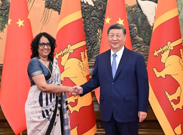 (251014) -- BEIJING, Oct. 14, 2025 (Xinhua) -- Chinese President Xi Jinping meets with Sri Lankan Prime Minister Harini Amarasuriya, who is in Beijing for the Global Leaders' Meeting on Women, at the Great Hall of the People in Beijing, capital of China, Oct. 14, 2025. (Xinhua/Li Xiang)