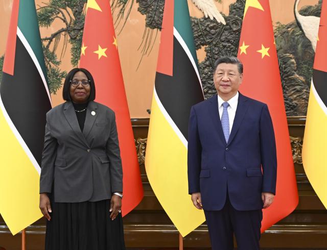 (251014) -- BEIJING, Oct. 14, 2025 (Xinhua) -- Chinese President Xi Jinping meets with Prime Minister of Mozambique Maria Benvinda Delfina Levi, who is in Beijing for the Global Leaders' Meeting on Women, at the Great Hall of the People in Beijing, capital of China, Oct. 14, 2025. (Xinhua/Zhai Jianlan)