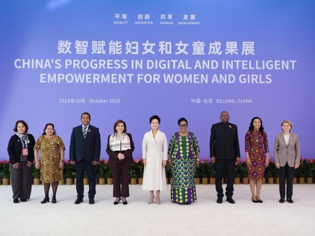 (251014) -- BEIJING, Oct. 14, 2025 (Xinhua) -- Peng Liyuan, wife of Chinese President Xi Jinping and a UNESCO special envoy for the advancement of girls' and women's education, and UN Under-Secretary-General and UN Women Executive Director Sima Bahous attend an exhibition showcasing China's progress in digital and intelligent empowerment for women and girls in Beijing, capital of China, Oct. 14, 2025. The exhibition was opened on Tuesday as a side event of the Global Leaders' Meeting on Women. Peng and Bahous addressed the event. Spouses of foreign leaders, and heads of women's organizations also attended the event. (Xinhua/Ding Lin)