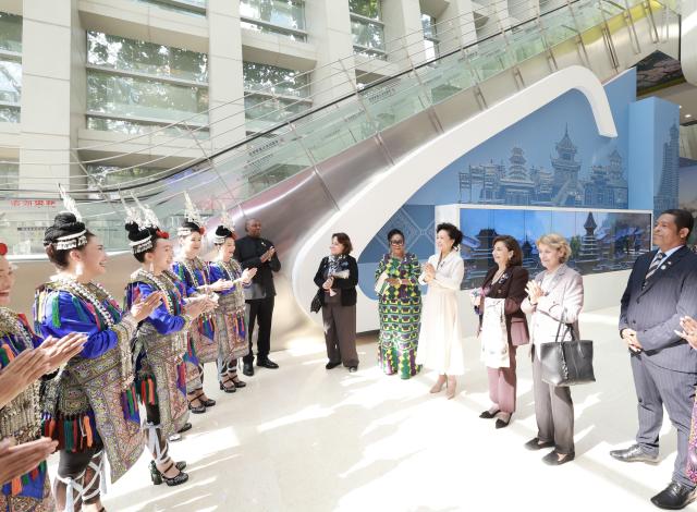 (251014) -- BEIJING, Oct. 14, 2025 (Xinhua) -- Peng Liyuan, wife of Chinese President Xi Jinping and a UNESCO special envoy for the advancement of girls' and women's education, and UN Under-Secretary-General and UN Women Executive Director Sima Bahous visit an exhibition showcasing China's progress in digital and intelligent empowerment for women and girls in Beijing, capital of China, Oct. 14, 2025. The exhibition was opened on Tuesday as a side event of the Global Leaders' Meeting on Women. Peng and Bahous addressed the event. Spouses of foreign leaders, and heads of women's organizations also attended the event. (Xinhua/Ding Lin)