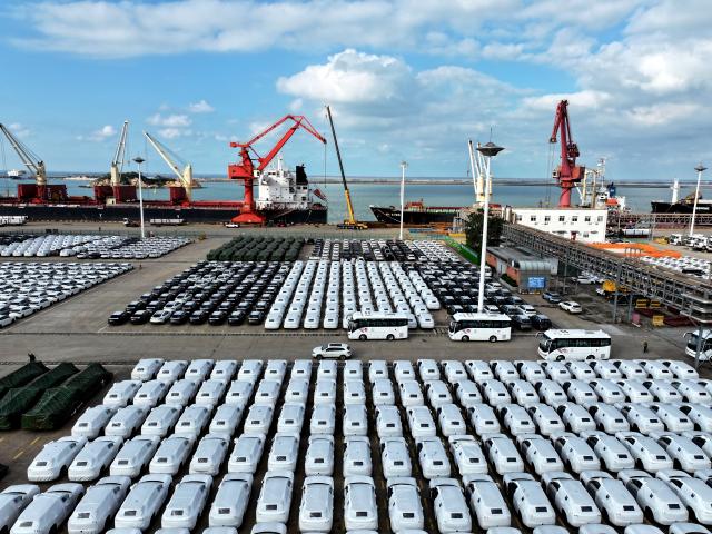(251014) -- BEIJING, Oct. 14, 2025 (Xinhua) -- An aerial drone photo taken on Oct. 14, 2025 shows cars ready for transportation parking at a wharf in Lianyungang, east China's Jiangsu Province. China's new energy vehicle (NEV) sector maintained strong momentum in production and sales in the first nine months of the year, according to industry data released Tuesday.
   NEV production jumped 35.2 percent year on year to 11.24 million units during the first three quarters, as reported by China Association of Automobile Manufacturers (CAAM).
   Sales during the same period climbed 34.9 percent year on year to nearly 11.23 million units, accounting for 46.1 percent of total vehicle sales in China, CAAM data showed. (Photo by Wang Chun/Xinhua)