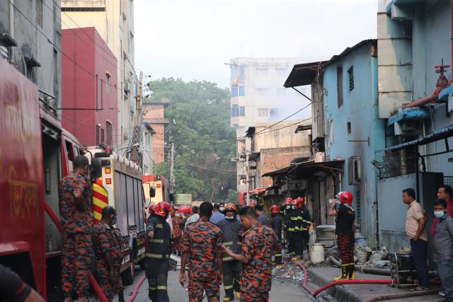 (251014) -- DHAKA, Oct. 14, 2025 (Xinhua) -- This photo taken on Oct. 14, 2025 shows firefighters working to put out the fire at a garment factory and a chemical warehouse in Dhaka, Bangladesh. At least 16 people were killed after a devastating fire tore through a garment factory and a chemical warehouse in the Bangladeshi capital of Dhaka. (Photo by Habibur Rahman/Xinhua)