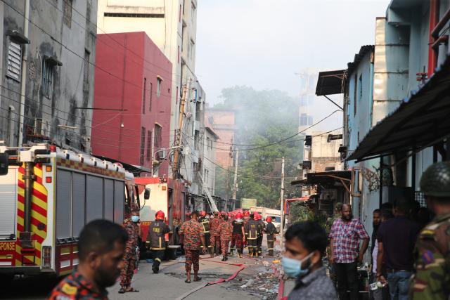 (251014) -- DHAKA, Oct. 14, 2025 (Xinhua) -- This photo taken on Oct. 14, 2025 shows firefighters working to put out the fire at a garment factory and a chemical warehouse in Dhaka, Bangladesh. At least 16 people were killed after a devastating fire tore through a garment factory and a chemical warehouse in the Bangladeshi capital of Dhaka. (Photo by Habibur Rahman/Xinhua)