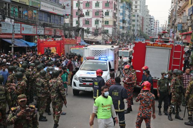 (251014) -- DHAKA, Oct. 14, 2025 (Xinhua) -- This photo taken on Oct. 14, 2025 shows ambulances arriving at the scene after fire broke out at a garment factory and a chemical warehouse in Dhaka, Bangladesh. At least 16 people were killed after a devastating fire tore through a garment factory and a chemical warehouse in the Bangladeshi capital of Dhaka. (Photo by Habibur Rahman/Xinhua)