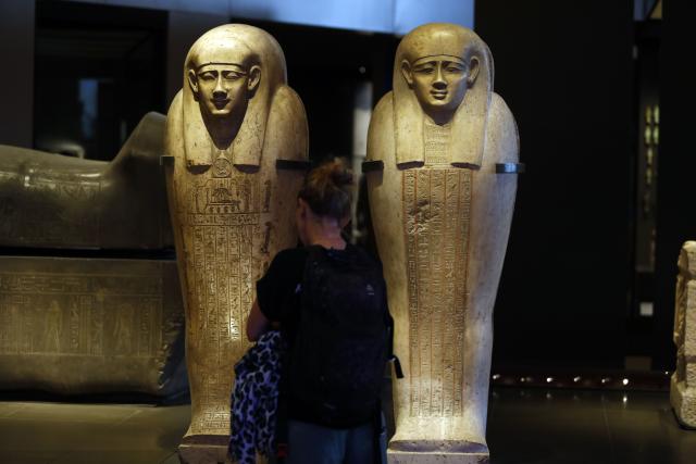 (251014) -- CAIRO, Oct. 14, 2025 (Xinhua) -- A tourist views exhibits at the Grand Egyptian Museum in Giza, Egypt, Oct. 14, 2025. Egypt's Grand Egyptian Museum (GEM) is temporarily closed to the public from Oct. 15 to Nov. 3 in preparation for its official opening, scheduled for early November, according to an announcement published Monday on the museum's official website. (Xinhua/Ahmed Gomaa)