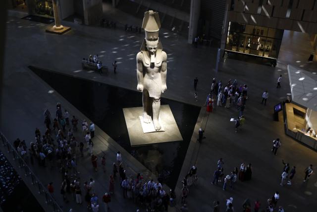 (251014) -- CAIRO, Oct. 14, 2025 (Xinhua) -- Tourists stand around the colossus of ancient Egyptian pharaoh Ramses II at the Grand Egyptian Museum in Giza, Egypt, Oct. 14, 2025. Egypt's Grand Egyptian Museum (GEM) is temporarily closed to the public from Oct. 15 to Nov. 3 in preparation for its official opening, scheduled for early November, according to an announcement published Monday on the museum's official website. (Xinhua/Ahmed Gomaa)