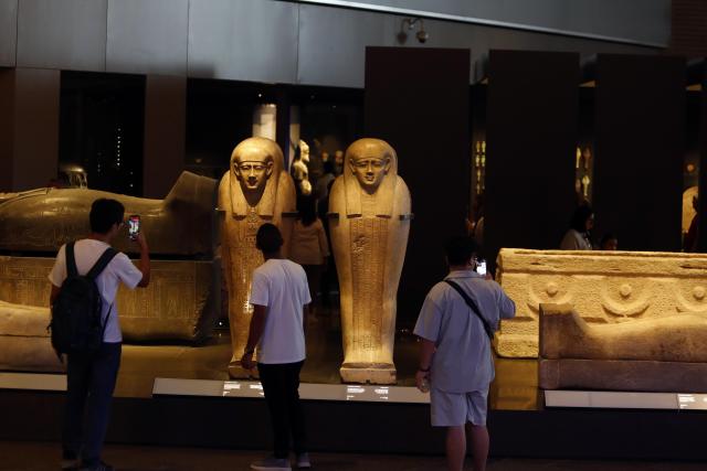 (251014) -- CAIRO, Oct. 14, 2025 (Xinhua) -- Tourists view exhibits at the Grand Egyptian Museum in Giza, Egypt, Oct. 14, 2025. Egypt's Grand Egyptian Museum (GEM) is temporarily closed to the public from Oct. 15 to Nov. 3 in preparation for its official opening, scheduled for early November, according to an announcement published Monday on the museum's official website. (Xinhua/Ahmed Gomaa)