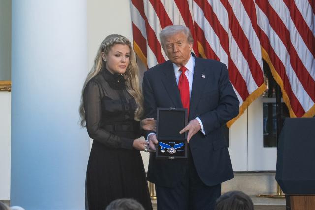 (251014) -- WASHINGTON, Oct. 14, 2025 (Xinhua) -- U.S. President Donald Trump (R) presents the Presidential Medal of Freedom to Erika Kirk during a ceremony to posthumously award the medal to Charlie Kirk, in the Rose Garden of the White House, in Washington, D.C., the United States, Oct. 14, 2025. (Xinhua/Hu Yousong)