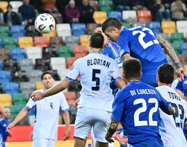 (251015) -- UDINE, Oct. 15, 2025 (Xinhua) -- Gianluca Mancini (Top R) of Italy heads for the ball to score during the FIFA World Cup 2026 European Qualifiers Group I match between Italy and Israel in Udine, Italy, Oct. 14, 2025. (Photo by Diego Petrussi/Xinhua)