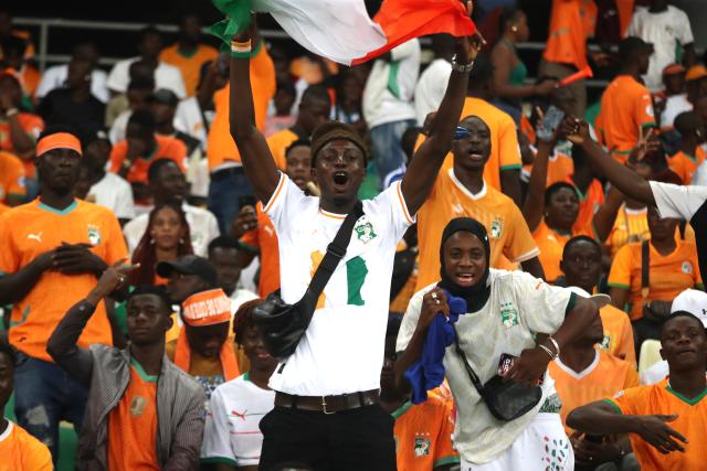 (251015) -- ABIDJAN, Oct. 15, 2025 (Xinhua) -- Supporters of Cote d'Ivoire cheer for the team before the FIFA World Cup 2026 CAF Qualifiers Group F match between Cote d'Ivoire and Kenya in Abidjan, Cote d'Ivoire, Oct. 14, 2025. (Photo by Yvan Sonh/Xinhua)