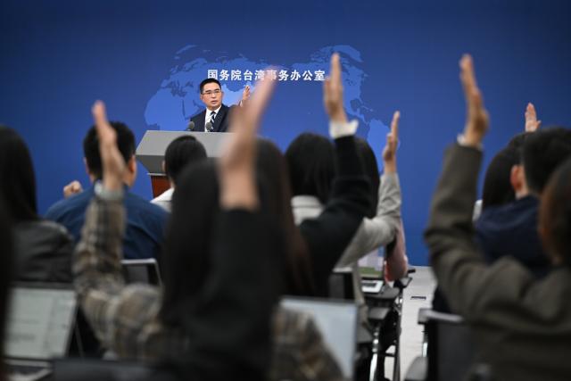 (251015) -- BEIJING, Oct. 15, 2025 (Xinhua) -- Chen Binhua, a spokesperson for the Taiwan Affairs Office of the State Council, gestures at a press conference in Beijing, capital of China, Oct. 15, 2025. (Xinhua/Chen Yehua)