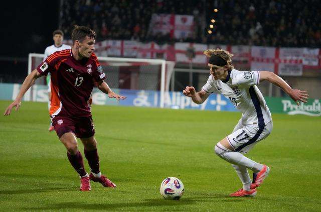 (251015) -- RIGA, Oct. 15, 2025 (Xinhua) -- Raivis Jurkovskis (L) of Latvia vies with Anthony Gordon of England during the 2026 FIFA World Cup European Qualifiers football match between Latvia and England in Riga, Latvia, Oct. 14, 2025. (Photo by Edijs Palens/Xinhua)
