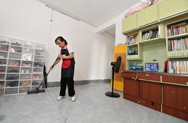 (251015) -- FENGSHAN, Oct. 15, 2025 (Xinhua) -- Lan Yezhen cleans her home in Fengshan County, south China's Guangxi Zhuang Autonomous Region, Oct. 14, 2025.
  Lan Yezhen, a visually impaired writer from rural Guangxi, has carved a path of resilience through words.
   Life took a harsh turn when she had to forgo the national college entrance examination after her mother's passing. She then spent years working as a migrant worker.
   In 2018, progressive eye conditions left her completely blind, plunging the mother of two young children into despair.
   Amid the darkness, audiobooks became her beacon of solace. Inspired by literary characters who overcame adversity, she began documenting her own life story.
   With growing support from her community and beyond, Lan persisted in her writing. Her essays were published in literary journals, which led to her admission into the Guangxi Writers Association in 2024.
   Through her words, she invites readers into her inner world and reveals the hope that endures despite adversity.
   "Writing helped me find my own light," Lan said. "Even in darkness, I can carve out a path forward for myself." (Xinhua/Lu Boan)