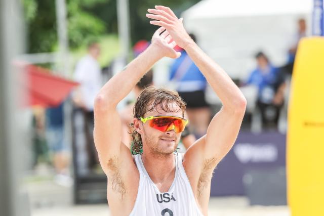 (251015) -- LAGUNA PROVINCE, Oct. 15, 2025 (Xinhua) -- Logan Webber of the United States celebrates winning the men's qualification match between Hagen Smith/Logan Webber of the United States and Florian Breer/Luc Fluckiger of Switzerland at the Volleyball World Beach Pro Tour in Laguna Province, the Philippines, Oct. 15, 2025. (Xinhua/Rouelle Umali)