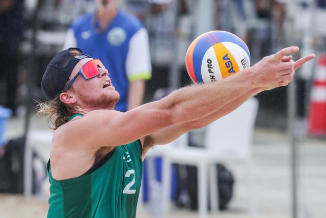 (251015) -- LAGUNA PROVINCE, Oct. 15, 2025 (Xinhua) -- Oliver Merritt of Australia digs the ball during the men's qualification match between Ben Hood/Oliver Merritt of Australia and Luke de Greef/Martin Licht of Canada at the Volleyball World Beach Pro Tour in Laguna Province, the Philippines, Oct. 15, 2025. (Xinhua/Rouelle Umali)