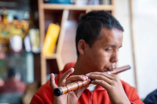 (251015) -- LHASA, Oct. 15, 2025 (Xinhua) -- Tawa Tsering plays flute in Lhasa, southwest China's Xizang Autonomous Region, Oct. 10, 2025. Twenty-six-year-old Tawa Tsering is a musician of band "Kardag Garbo," the first band in Xizang composed of visually impaired members. The band was established in 2014 and its name means pure white Khata, a ceremonial white scarf symbolizing goodwill and blessings. 
   In 2019, Tawa Tsering joined the band and began to learn playing flute and Yangqin. In addition to performing, he handles the band's daily affairs, such as arranging performances, exploring business collaborations, and booking performance venues.
   Music opened a vast world for Tawa Tsering and also led him to love. He married Bumchok, sister of the band's founder, and is now father of two children.
   "If life is entirely wasted just because of a physical disability, it would be the greatest regret," this is the shared belief of the members of the band. Every summer, they tour villages and towns to stage performances. "We hold performances every year to encourage people like us through concrete actions," said Tawa Tsering. (Xinhua/Tenzing Nima Qadhup)