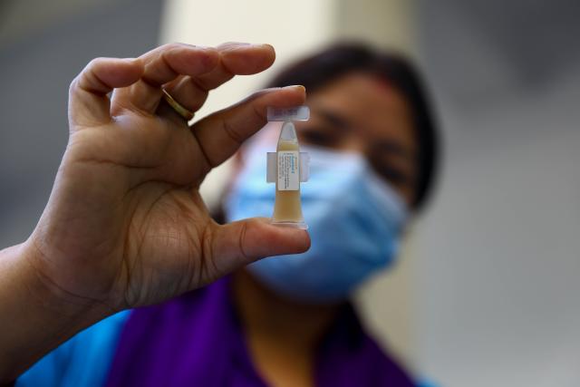 (251015) -- PARSA, Oct. 15, 2025 (Xinhua) -- A doctor shows an oral cholera vaccine during the cholera vaccination campaign in Parsa district, Nepal, Oct. 15, 2025. (Photo by Sulav Shrestha/Xinhua)