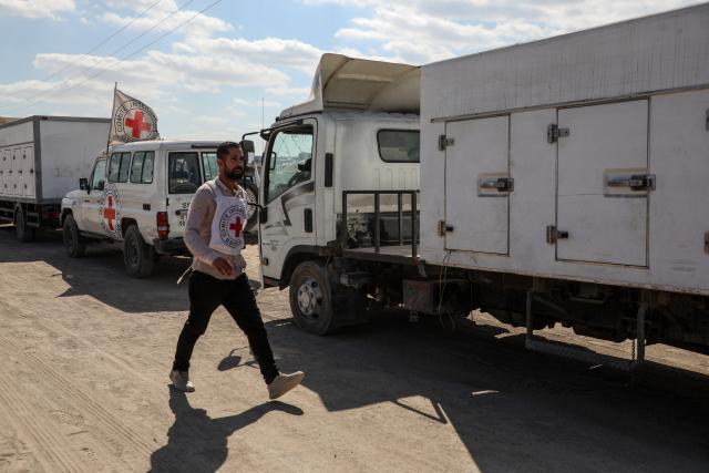 (251015) -- GAZA, Oct. 15, 2025 (Xinhua) -- Vehicles carrying the bodies of Palestinians handed over from Israel to the International Committee of the Red Cross (ICRC), are seen near Nasser Hospital in the southern Gaza Strip city of Khan Younis, Oct. 15, 2025. (Photo by Rizek Abdeljawad/Xinhua)