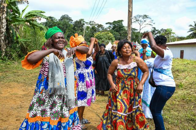(251015) -- YAOUNDE, Oct. 15, 2025 (Xinhua) -- Villagers celebrate after the official inauguration of the "Rural Solar" project built by a Chinese company in Songmimbias, the Central Region of Cameroon on Oct. 8, 2025. TO GO WITH "Zoom Africa: Solar panels light up African future" (Photo by Kepseu/Xinhua)