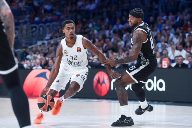 (251016) -- MADRID, Oct. 16, 2025 (Xinhua) -- Theo Maledon (L) of Real Madrid breaks through against Tyrique Jones of Partizan during the Euroleague basketball match between Real Madrid and Partizan in Madrid, Spain, Oct. 15, 2025. (Photo by Gustavo Valiente/Xinhua)