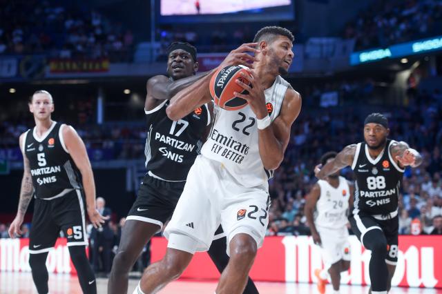 (251016) -- MADRID, Oct. 16, 2025 (Xinhua) -- Walter Tavares (R) of Real Madrid vies with Issac Bonga of Partizan during the Euroleague basketball match between Real Madrid and Partizan in Madrid, Spain, Oct. 15, 2025. (Photo by Gustavo Valiente/Xinhua)