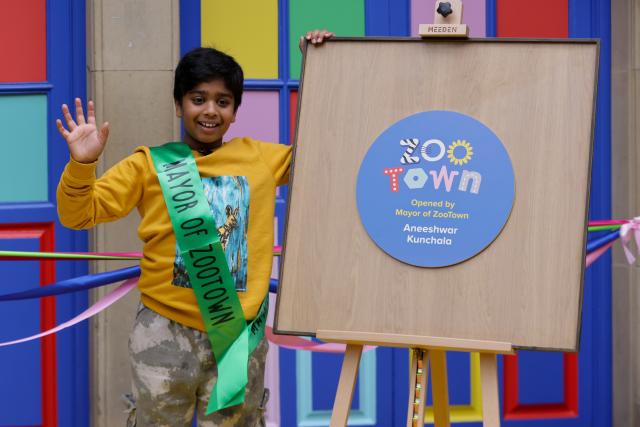 (251016) -- LONDON, Oct. 16, 2025 (Xinhua) -- Aneeshwar Kunchala, 10-year-old conservationist and "Mayor of ZooTown," reacts during the opening ceremony of ZooTown at London Zoo in London, Oct. 15, 2025.
  Opening to the public on Oct. 18, the ZooTown features multiple themed role-play stations where children can try their hands at working for wildlife, including preparing meals for animals in the Keeper Kitchen, fighting germs in the science lab or tracking wild animals in the field conservation station. (Xinhua)