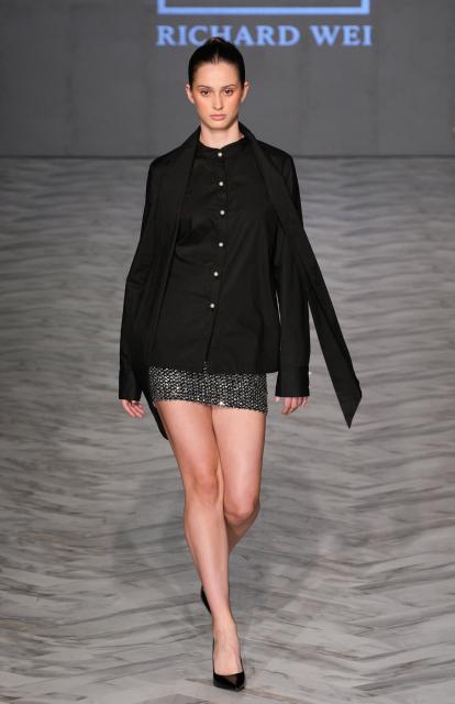 (251016) -- VANCOUVER, Oct. 16, 2025 (Xinhua) -- A model presents a creation of Richard Wei during the Spring/Summer 2026 Collections Fashion Show at Vancouver Fashion Week in Vancouver, British Columbia, Canada, Oct. 15, 2025. (Photo by Liang Sen/Xinhua)