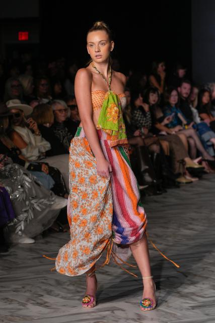 (251016) -- VANCOUVER, Oct. 16, 2025 (Xinhua) -- A model presents a creation of ANAHATAU during the Spring/Summer 2026 Collections Fashion Show at Vancouver Fashion Week in Vancouver, British Columbia, Canada, Oct. 15, 2025. (Photo by Liang Sen/Xinhua)