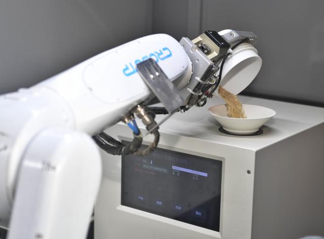 (251016) -- CHENGDU, Oct. 16, 2025 (Xinhua) -- A grain sampling robot automatically examines grain samples at a branch company of China Grain Reserves Group (Sinograin) in Chengdu, southwest China's Sichuan Province, Oct. 15, 2025.
  In recent years, advanced technologies have been applied in grain storage to significantly improve operational efficiency and quality of grain during storage. (Xinhua/Liu Kun)