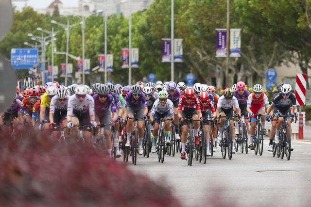 (251016) -- SHANGHAI, Oct. 16, 2025 (Xinhua) -- Cyclists compete during the Stage 3 of the UCI Women's WorldTour Tour of Chongming Island road cycling race in Shanghai, east China, Oct. 16, 2025. (Xinhua/Wang Xiang)