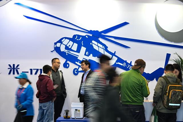 (251016) -- TIANJIN, Oct. 16, 2025 (Xinhua) -- People visit the 7th China Helicopter Exposition in Tianjin, north China, Oct. 16, 2025. Spanning an exhibition area of approximately 160,000 square meters, the exposition kicked off here on Thursday and will last until Oct. 19. (Xinhua/Sun Fanyue)